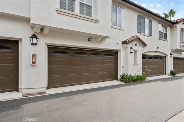 a view of a patio with table and chairs under an umbrella