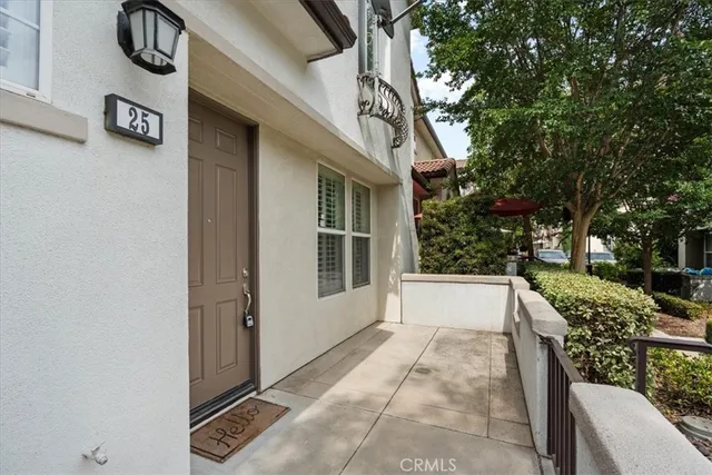 a view of empty room with wooden floor and fireplace