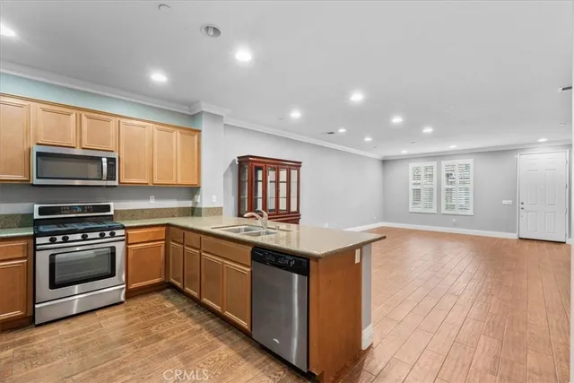 a kitchen with a sink and large window