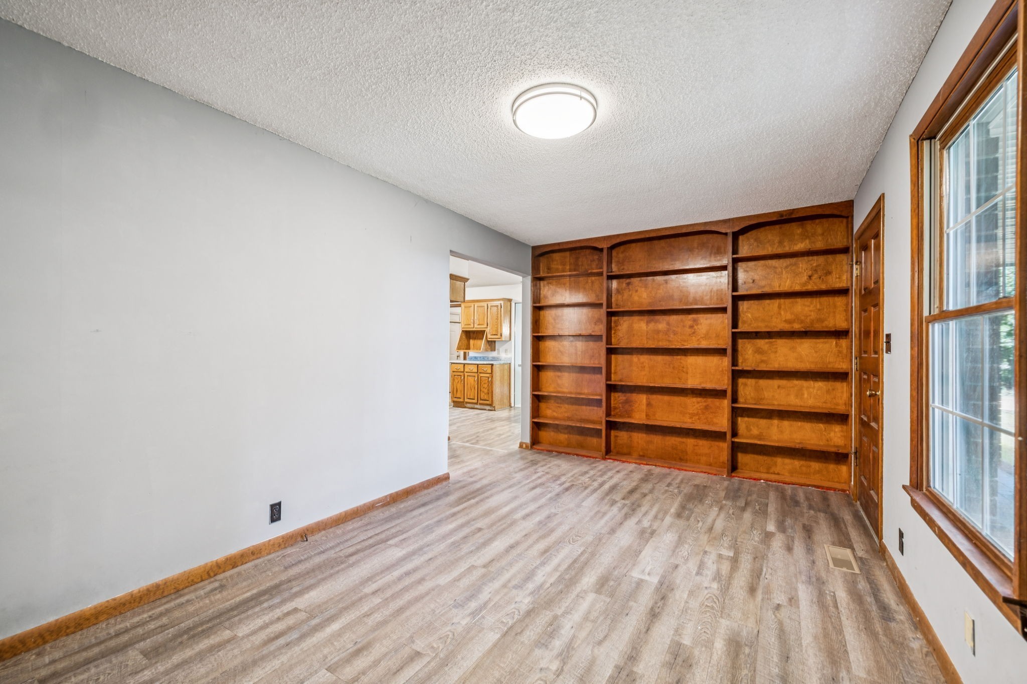 588 Sweeton Hill Road Coalmont, TN 37313 - Photo 11 of 51 a view of empty room with wooden floor and fan