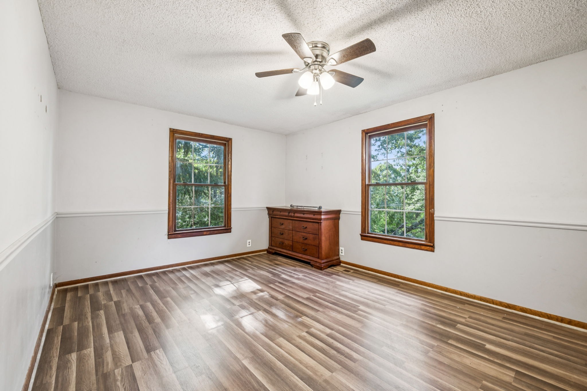 588 Sweeton Hill Road Coalmont, TN 37313 - Photo 17 of 51 a view of an empty room with wooden floor and a window