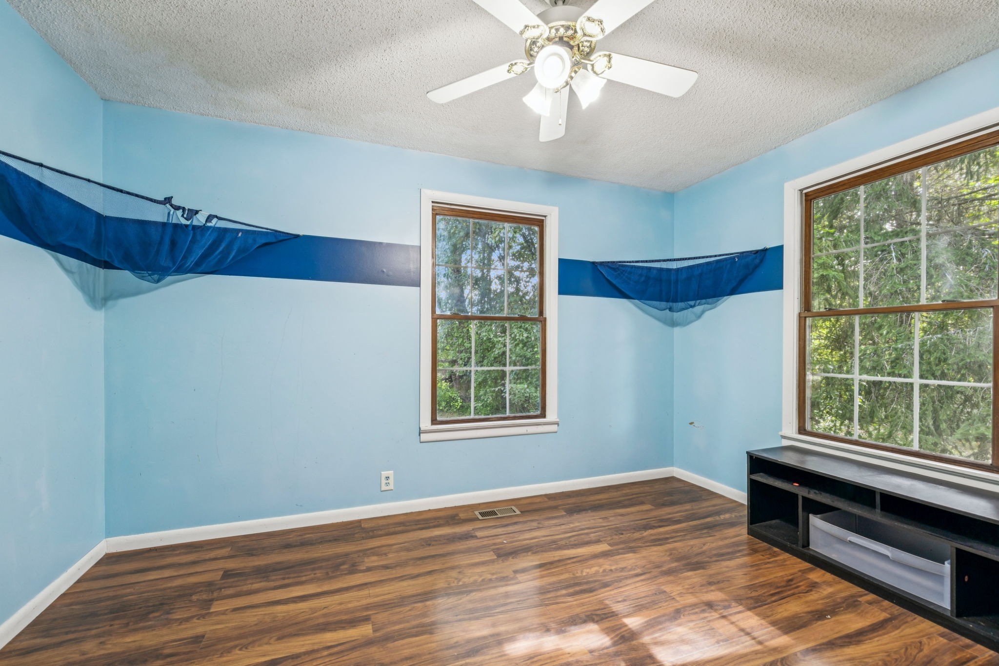 588 Sweeton Hill Road Coalmont, TN 37313 - Photo 20 of 51 a view of an empty room with wooden floor and a window