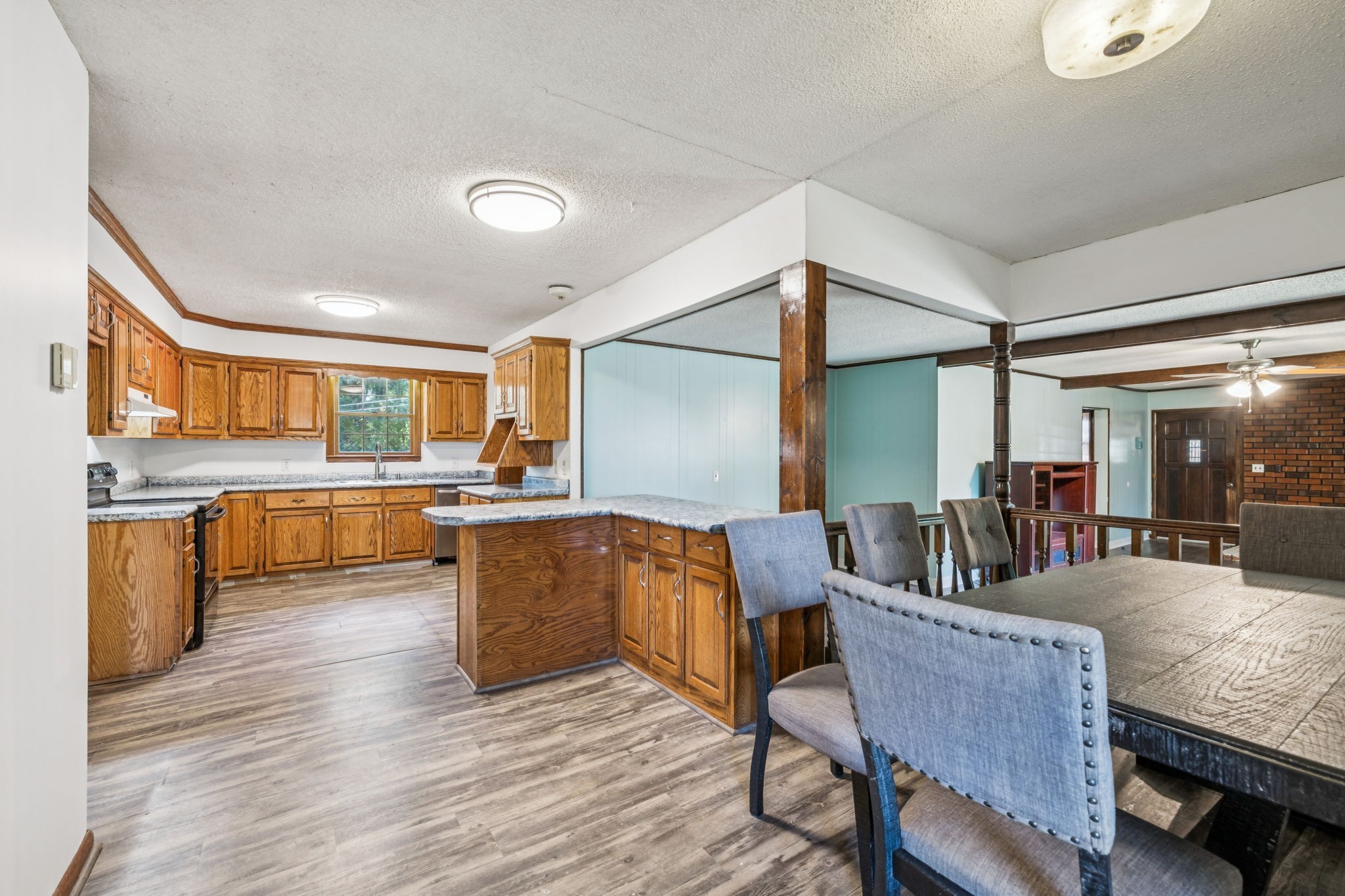588 Sweeton Hill Road Coalmont, TN 37313 - Photo 21 of 51 a living room with couches and kitchen view with wooden floor
