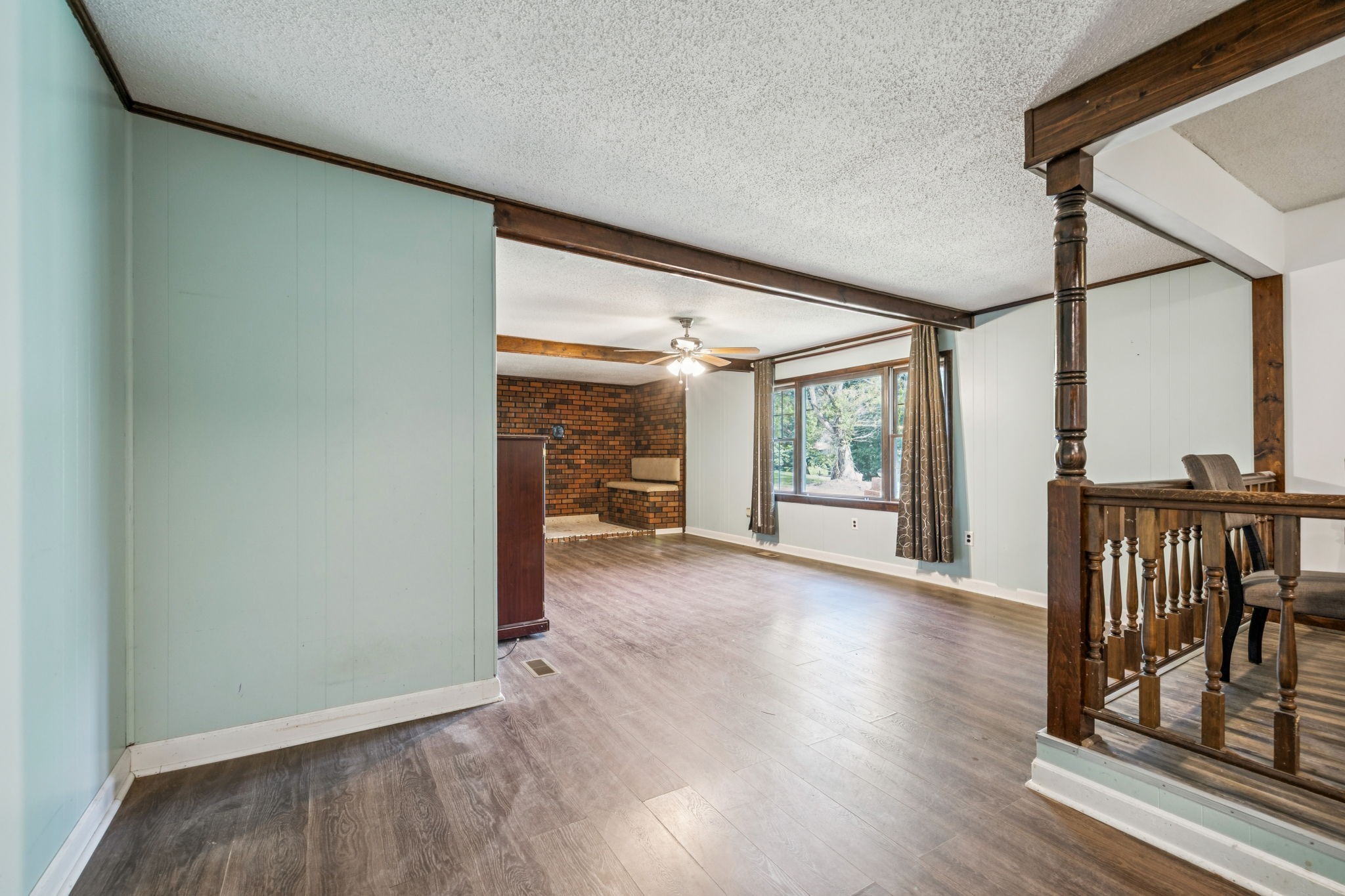 588 Sweeton Hill Road Coalmont, TN 37313 - Photo 28 of 51 an empty room with wooden floor and windows