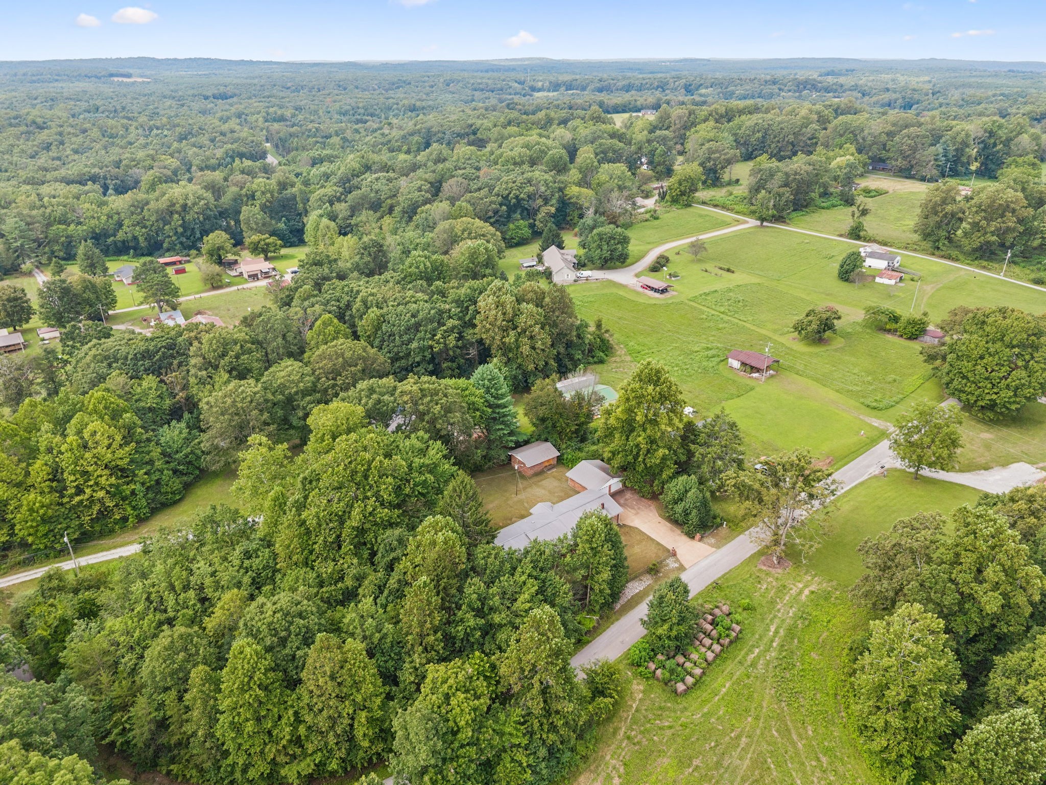 588 Sweeton Hill Road Coalmont, TN 37313 - Photo 38 of 51 an aerial view of residential houses with outdoor space and trees