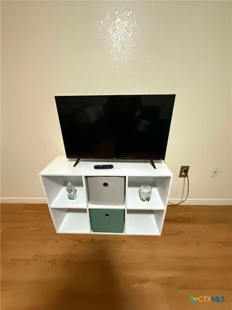 a view of kitchen island with wooden floor