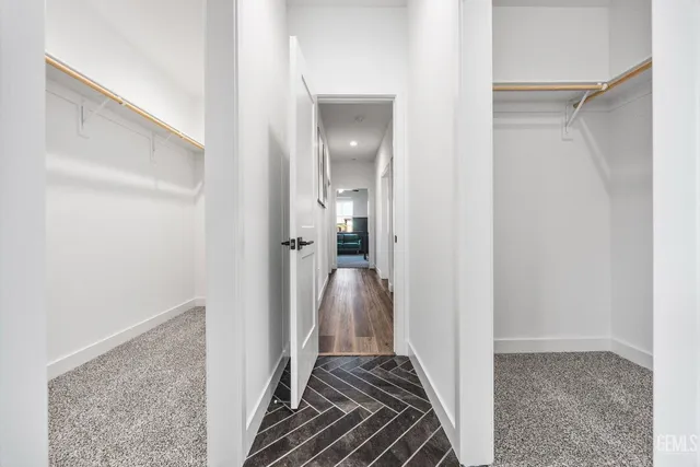 a view of a hallway view with wooden floor and staircase
