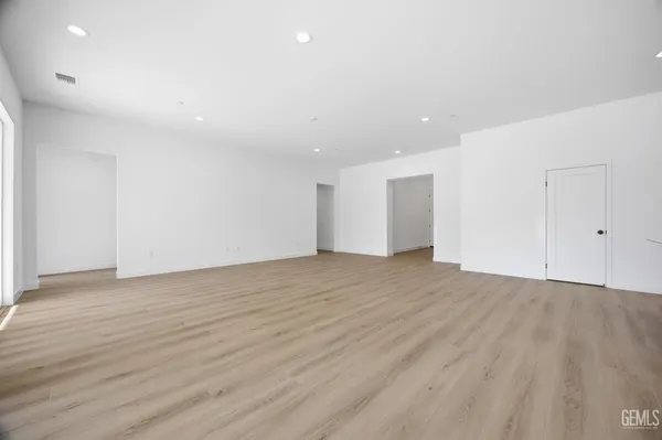 a white toilet sitting next to a bath tub