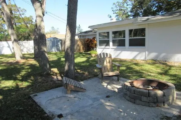 a backyard of house with outdoor seating