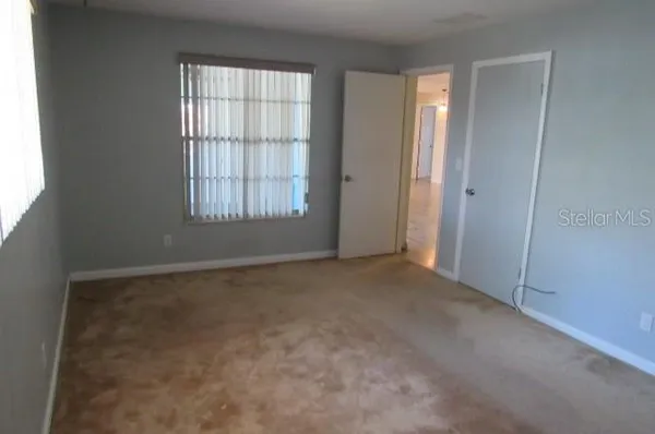 a view of an empty room with a window