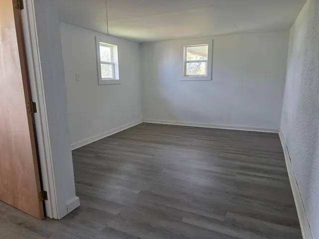 a backyard of a house with lots of green space