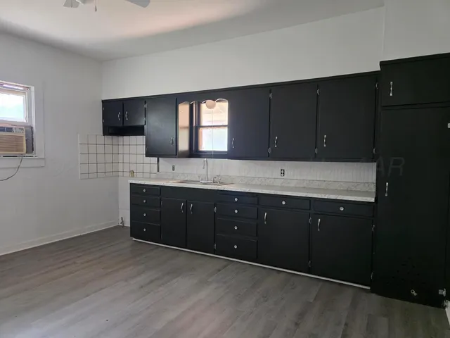 a bathroom with a sink double vanity and a mirror