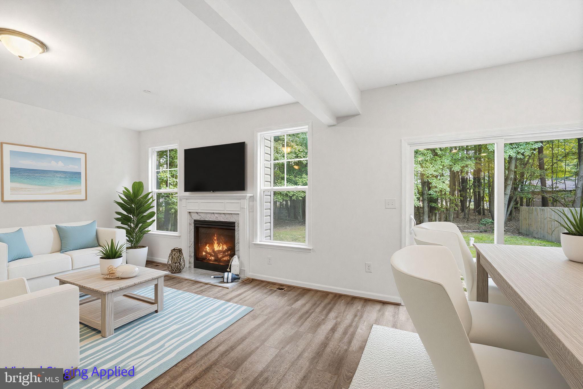 124 Riverside Drive Chester, MD 21619 - Photo 10 of 44 Living room/Dining Room with Sliders to backyard.