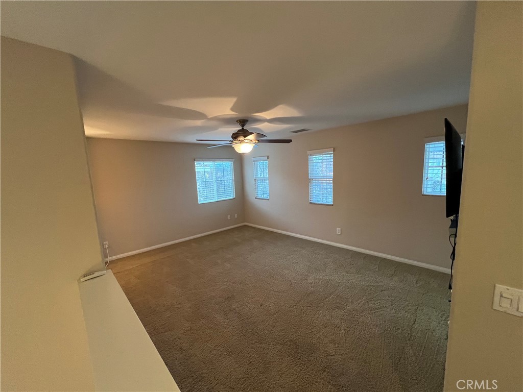 35429 Saddle Hill Road Lake Elsinore, CA 92532 - Photo 19 of 27 a view of an empty room with a window