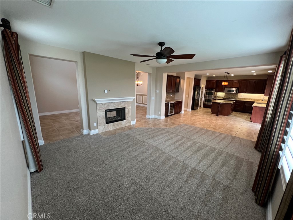 35429 Saddle Hill Road Lake Elsinore, CA 92532 - Photo 5 of 27 a view of a livingroom with an empty space and a fireplace