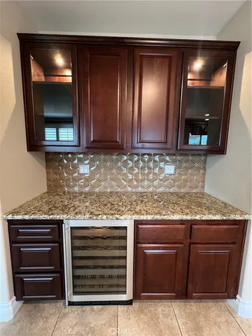 a kitchen with stainless steel appliances granite countertop a sink counter space cabinets and a view of kitchen