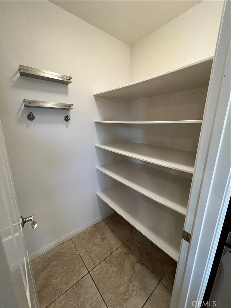 35429 Saddle Hill Road Lake Elsinore, CA 92532 - Photo 9 of 27 a view of walk in closet with empty racks