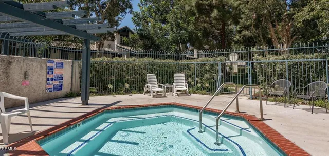 a view of a backyard with sitting area
