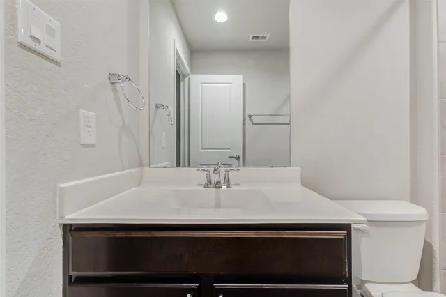 a sink sitting next to a white toilet