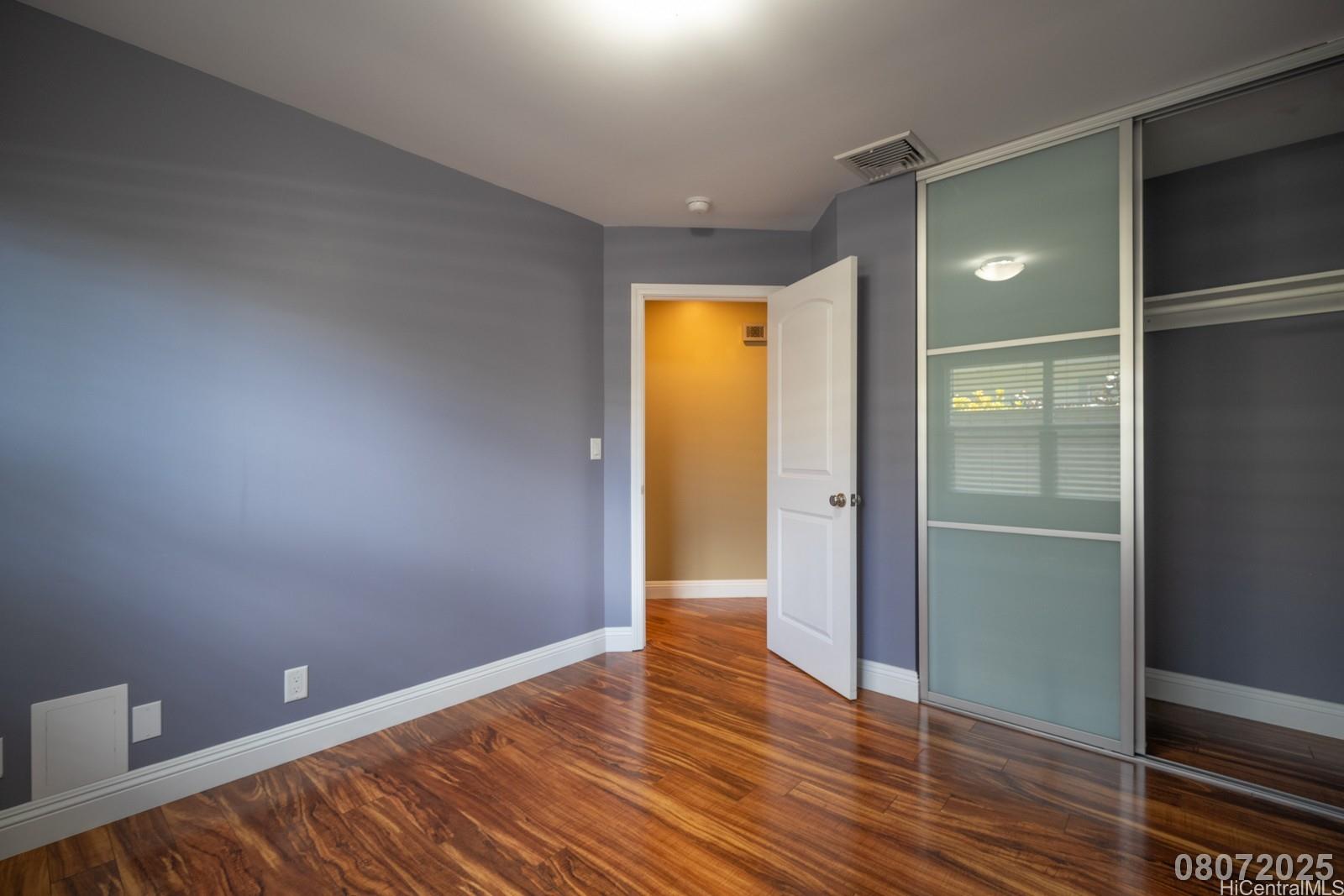 91-1014 Alepa Street Kapolei, HI 96707 - Photo 17 of 25 a view of empty room with wooden floor