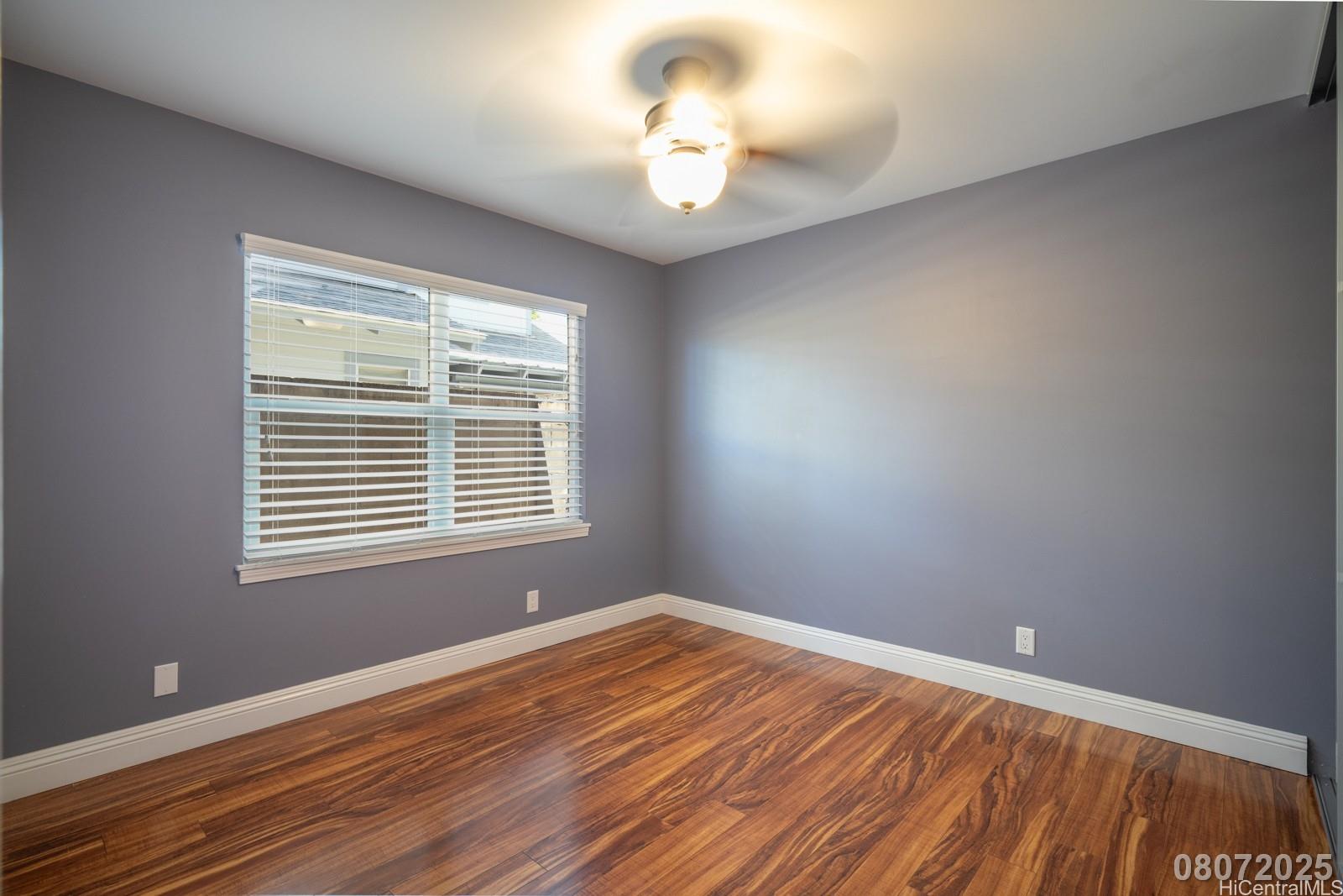 91-1014 Alepa Street Kapolei, HI 96707 - Photo 19 of 25 a view of empty room with wooden floor and fan
