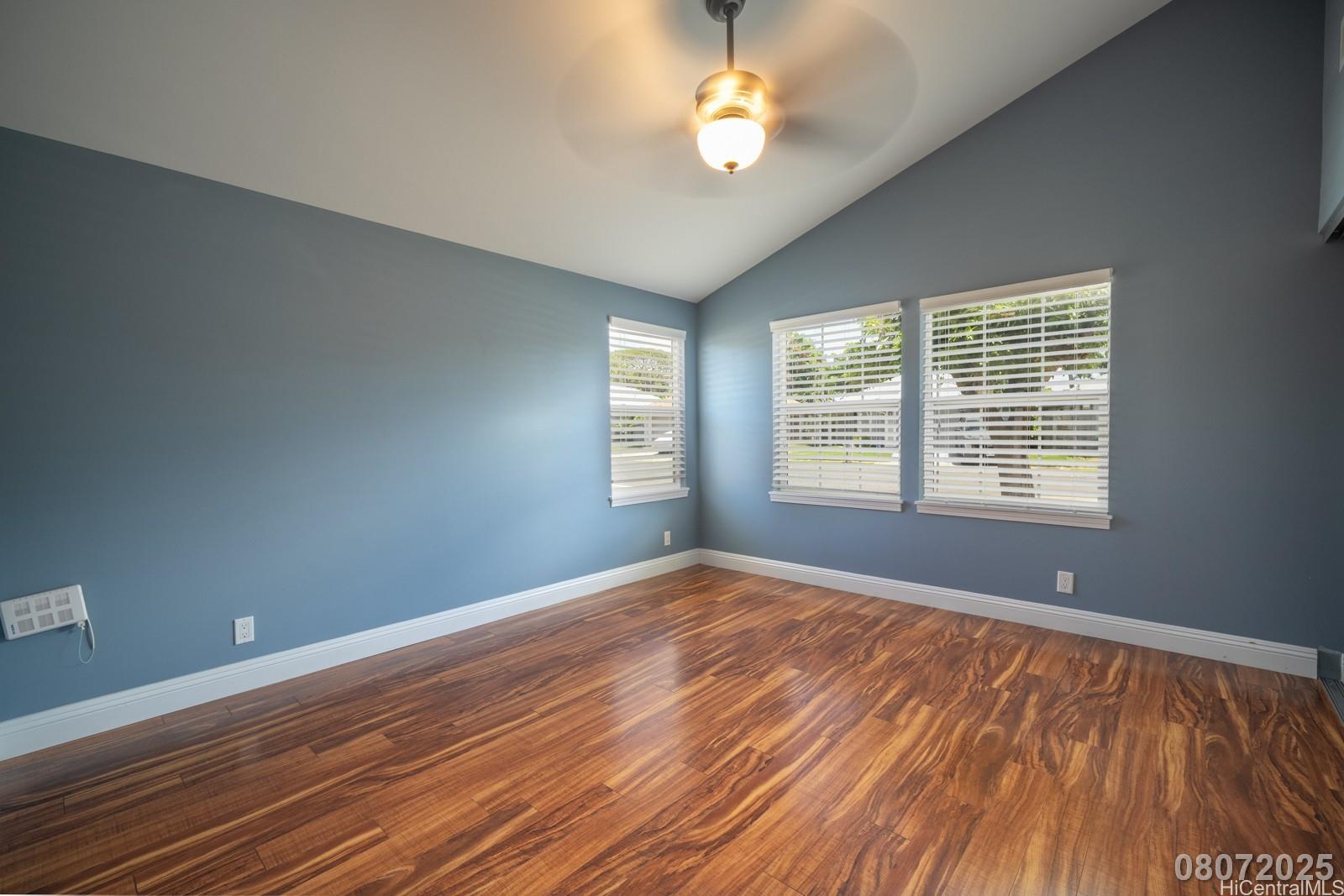 91-1014 Alepa Street Kapolei, HI 96707 - Photo 22 of 25 a view of an empty room with a window and wooden floor