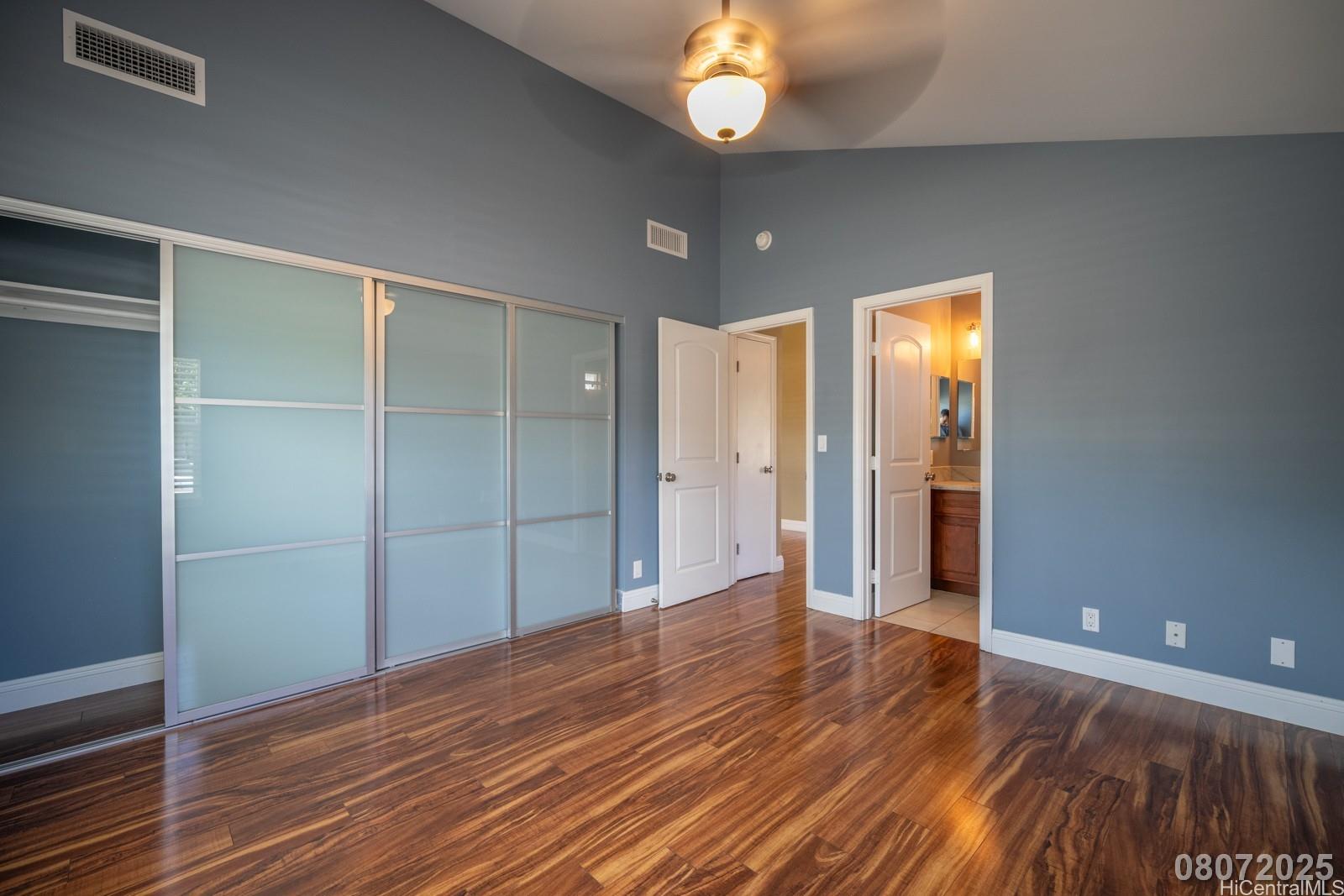 91-1014 Alepa Street Kapolei, HI 96707 - Photo 23 of 25 wooden floor in an empty room with a bathroom
