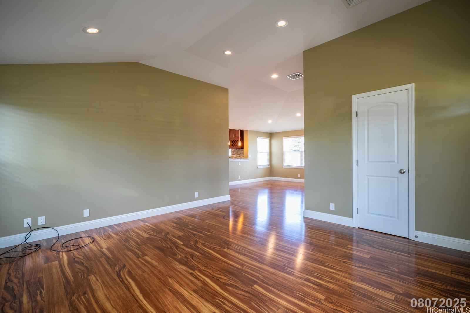 91-1014 Alepa Street Kapolei, HI 96707 - Photo 5 of 25 a view of empty room with wooden floor