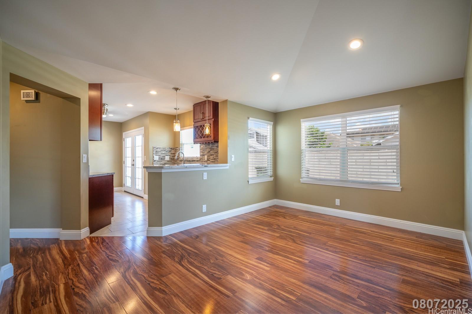 91-1014 Alepa Street Kapolei, HI 96707 - Photo 6 of 25 a view of kitchen with window and wooden floor
