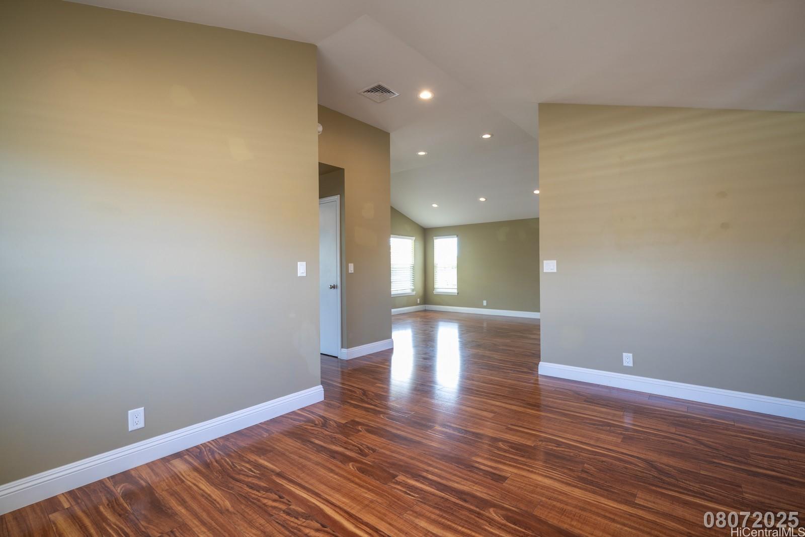 91-1014 Alepa Street Kapolei, HI 96707 - Photo 7 of 25 a view of empty room with wooden floor