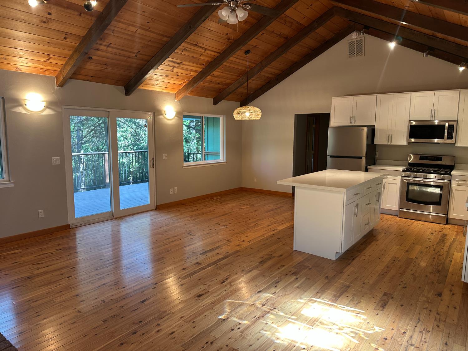 5570 5 Spot Road Placerville, CA 95667 - Photo 16 of 38 a view of a kitchen with furniture and a fireplace
