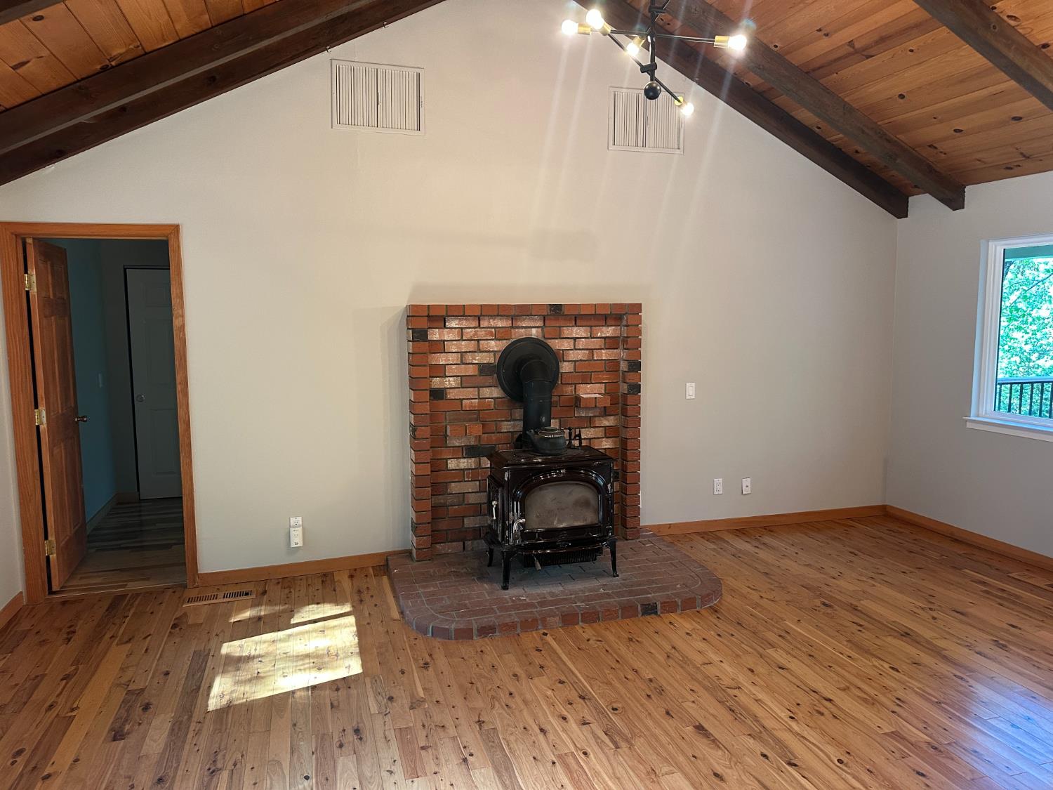 5570 5 Spot Road Placerville, CA 95667 - Photo 18 of 38 a view of a livingroom with wooden floor and chair