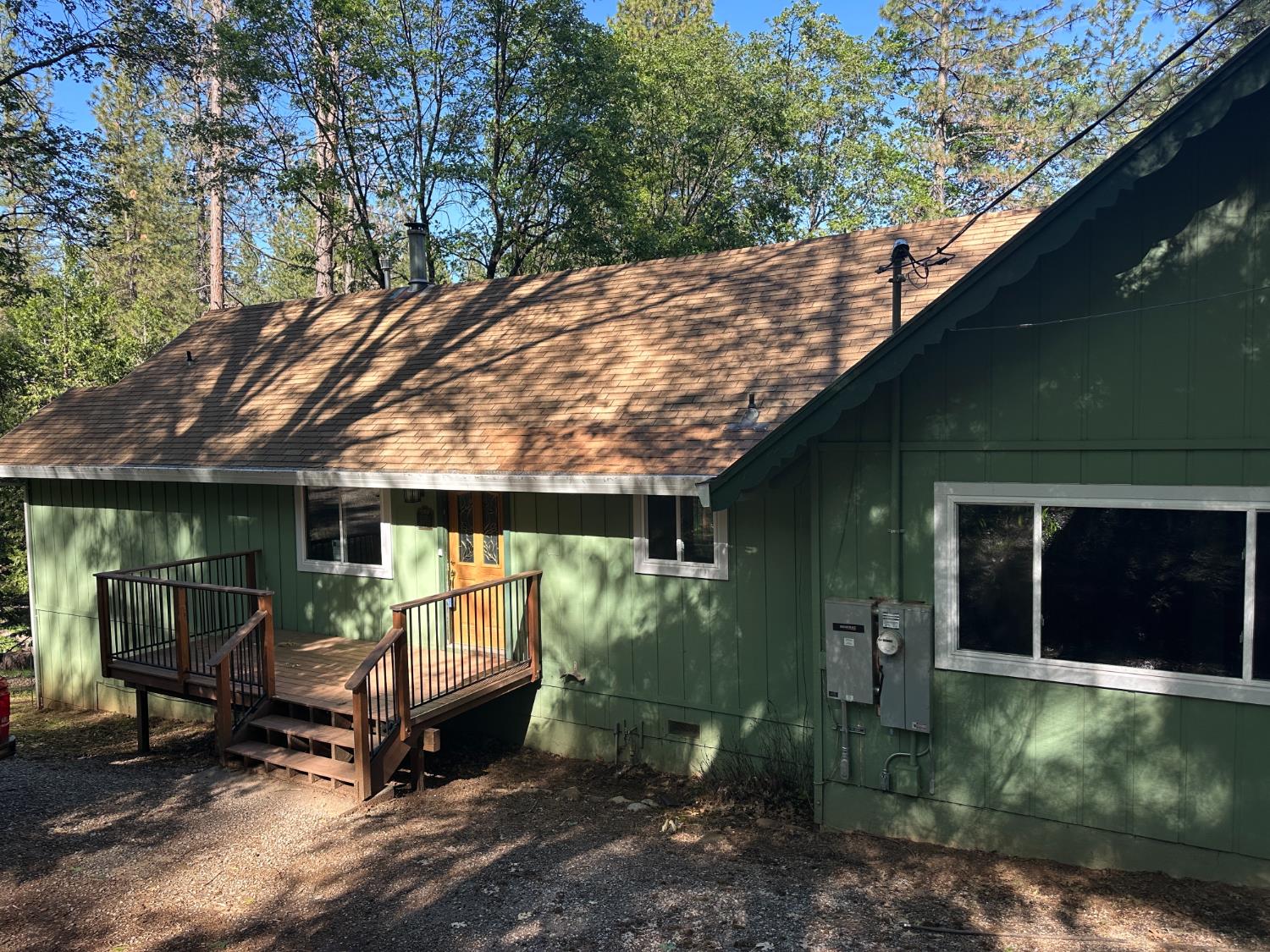 5570 5 Spot Road Placerville, CA 95667 - Photo 2 of 38 a backyard of a house with barbeque oven fire pit table and chairs