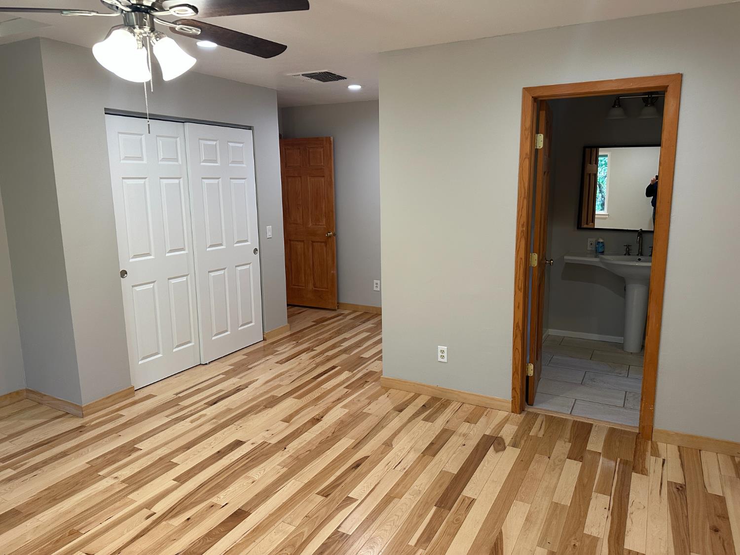 5570 5 Spot Road Placerville, CA 95667 - Photo 22 of 38 a view of a room with a dresser and chandelier