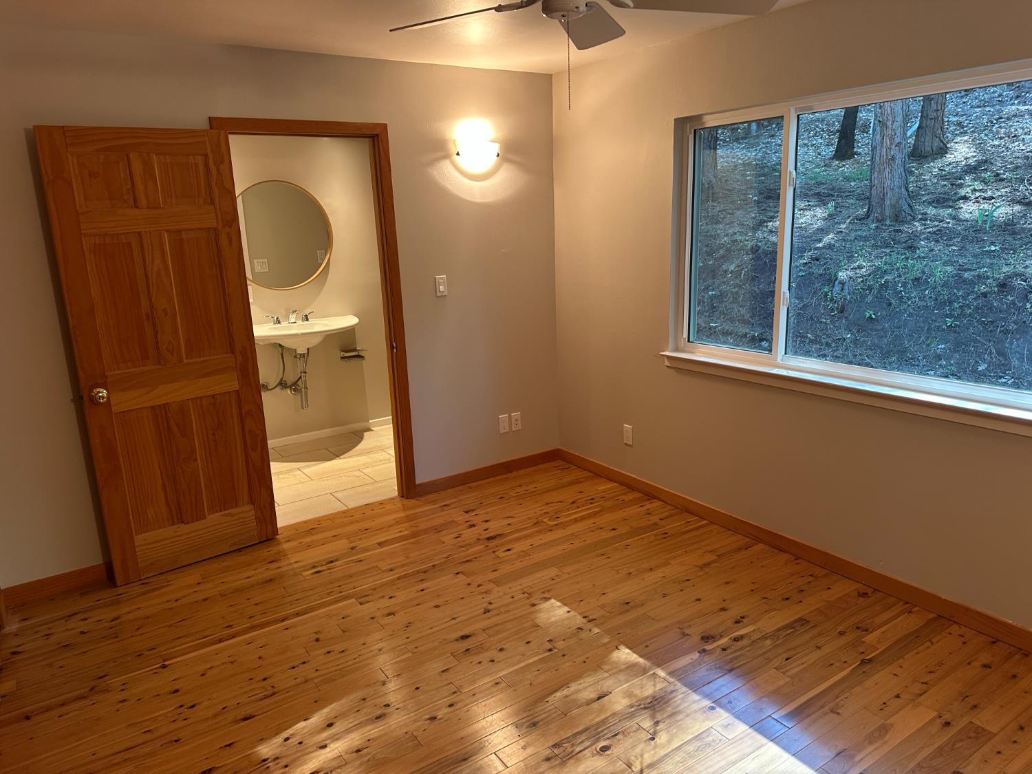 5570 5 Spot Road Placerville, CA 95667 - Photo 26 of 38 a view of a bathroom with a sink and a mirror