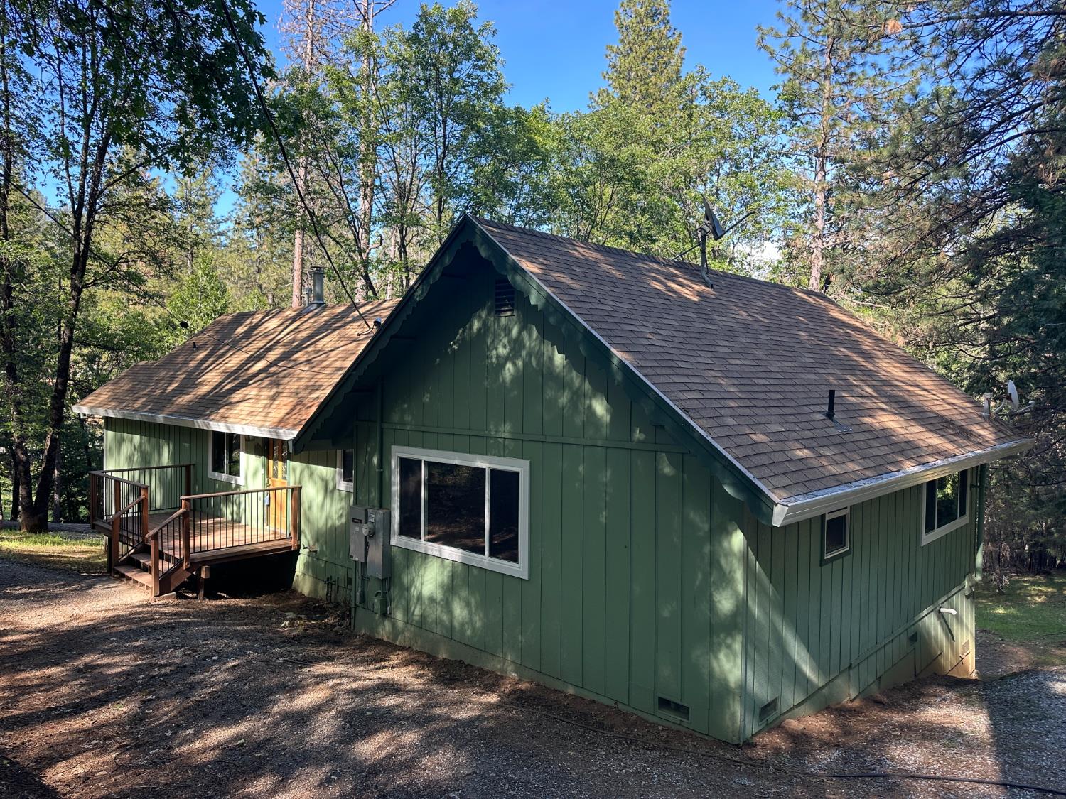 5570 5 Spot Road Placerville, CA 95667 - Photo 3 of 38 a view of a house with a chairs in a patio