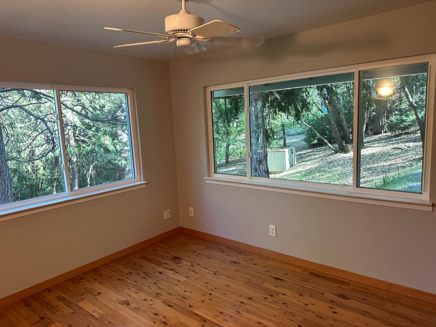 5570 5 Spot Road Placerville, CA 95667 - Photo 33 of 38 a view of empty room with wooden floor and fan