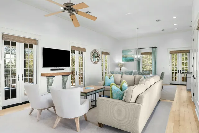 a view of a dining room with furniture and chandelier