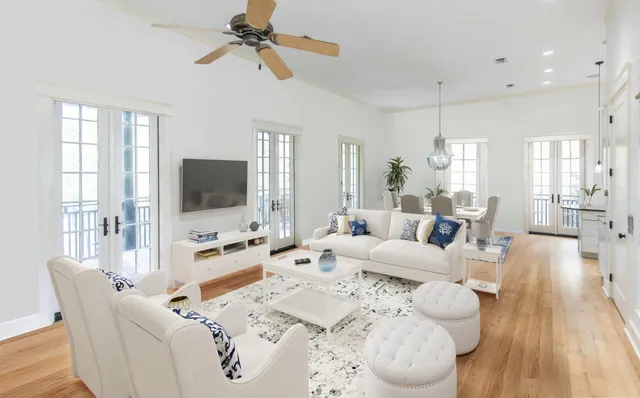 a view of a dining room with furniture window and wooden floor