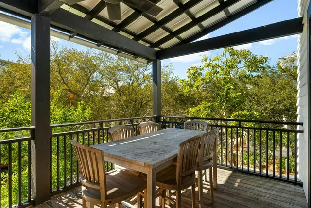 a bedroom with a bed a table and chair