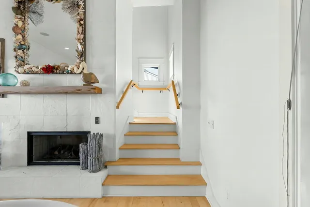 a view of a balcony with furniture and a floor to ceiling window