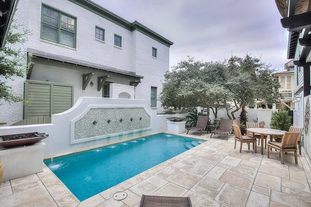 a kitchen with a stove and white cabinets