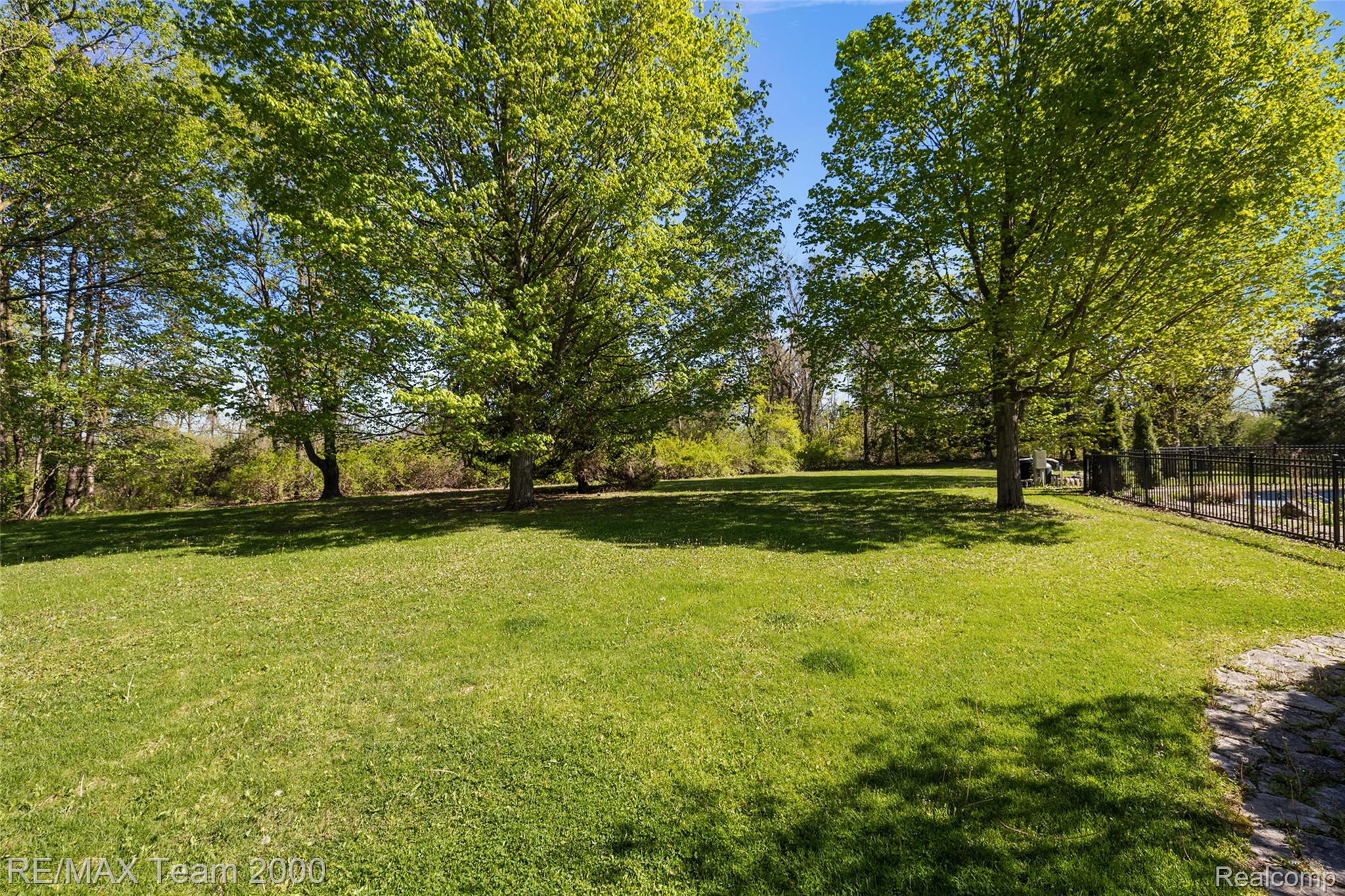 630 Sheldon Court Rochester, MI 48306 - Photo 4 of 94 View of yard with view of scattered trees