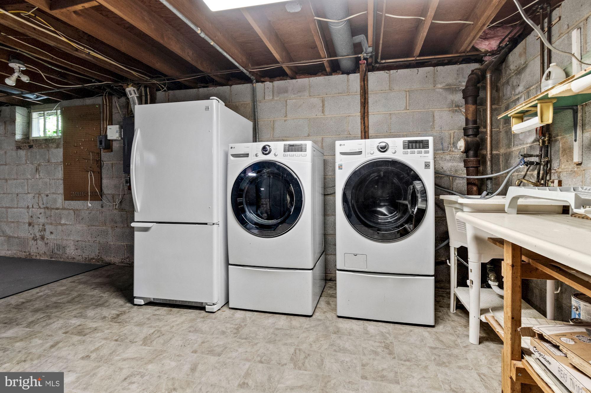 1010 Cannon Road Silver Spring, MD 20904 - Photo 29 of 31 Front loading washer and dryer and a 2nd refridge