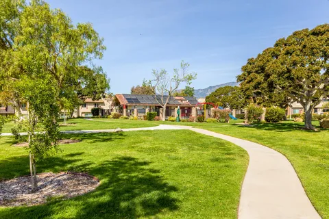 a view of house with a big yard