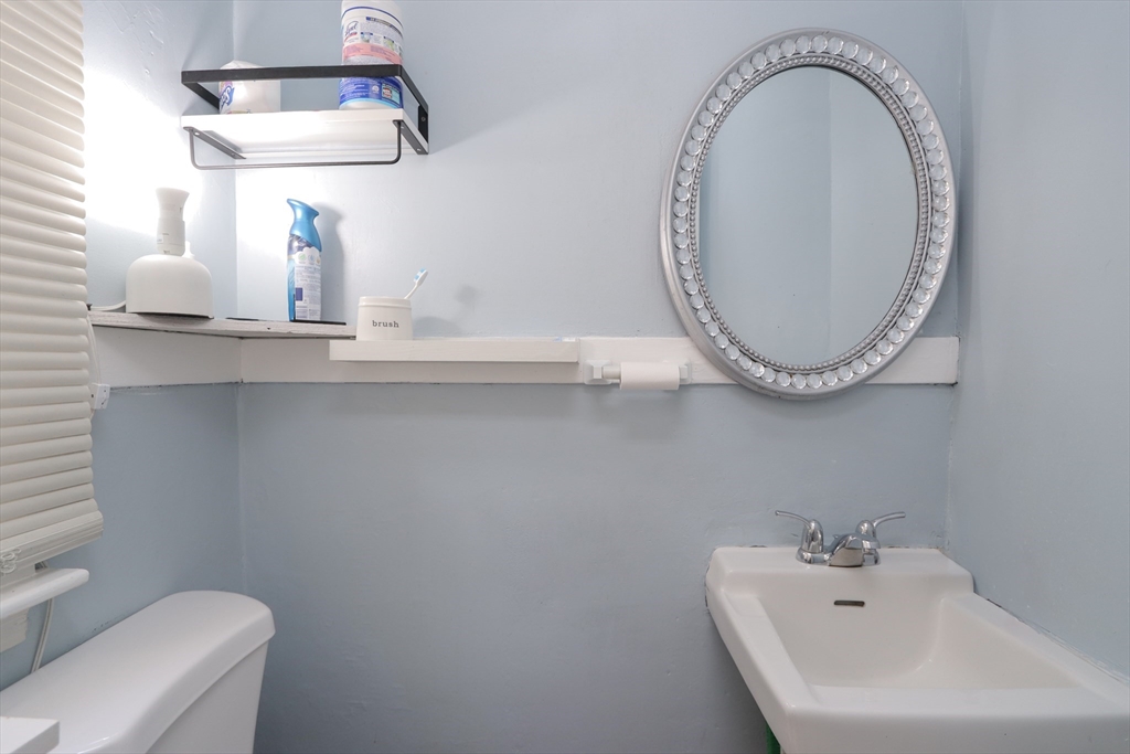 34 Preston Street Springfield, MA 01109 - Photo 29 of 34 a bathroom with a sink and a mirror