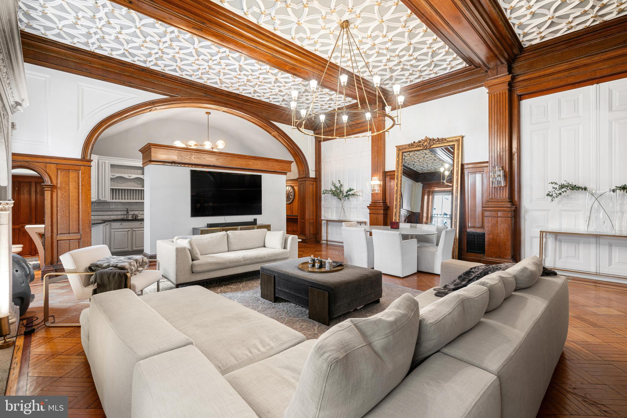 251-59 South 22nd Street, Unit A Philadelphia, PA 19103 - Photo 11 of 37 a living room with furniture and a flat screen tv