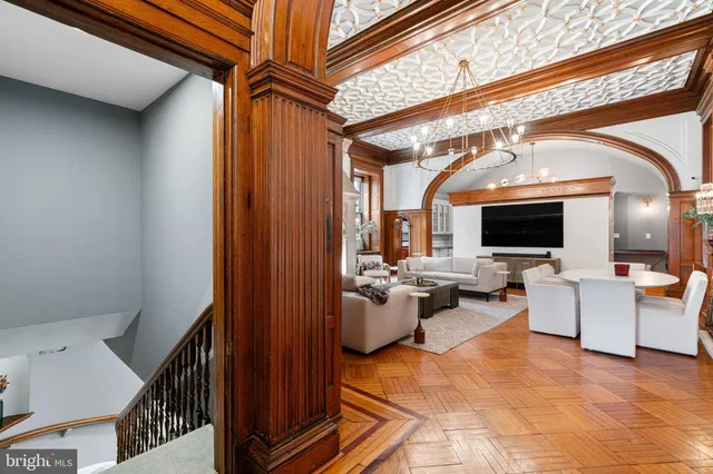 a view of living room filled with furniture and a flat screen tv