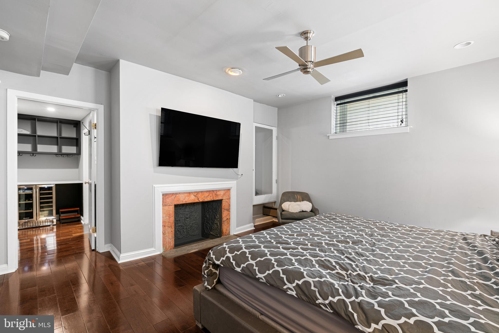 251-59 South 22nd Street, Unit A Philadelphia, PA 19103 - Photo 21 of 37 a bedroom with a bed and a flat screen tv