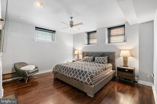 a bedroom with a bed and a chair